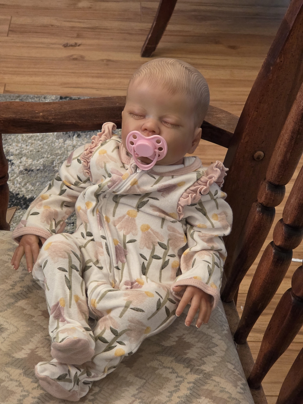 Reborn newborn doll In Floral Ruffled Infant Sleeper with Pink Pacifier